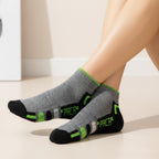 Gray socks with green accents g on a light background