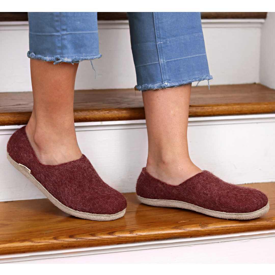 Nootkas Victoria Wool House Shoe on model in Bordeaux red with tan sole