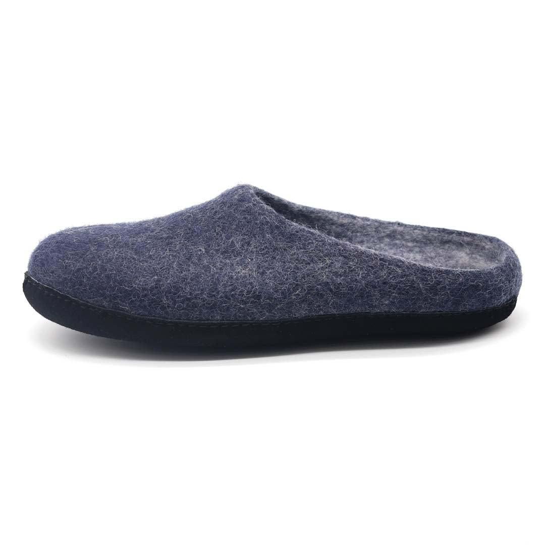Side view of Nootkas Astoria Wool House Slipper in indigo blue with black sole